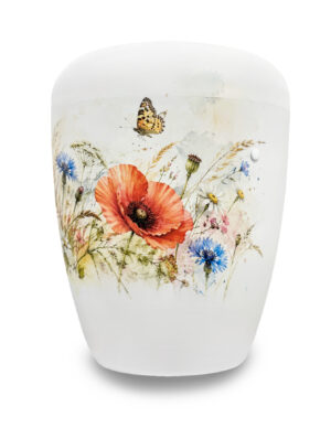 Weiße Urne mit bunter Sommerblumenwiese, Mohnblumen und Kornblumen